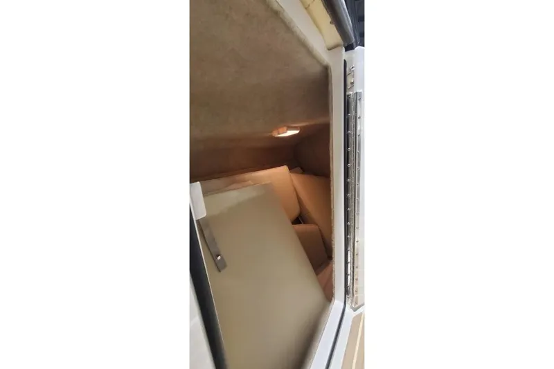 Slide: The Image of 2017 Formula 350 Crossover Bowrider cabin interior with beige upholstery and lighting. - 55