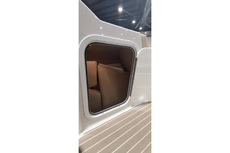 Slide: The Image of 2017 Formula 350 Crossover Bowrider storage compartment with open hatch, showcasing interior space. - 56