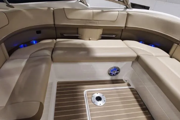Slide: The Image of 2017 Formula 350 Crossover Bowrider interior with beige seating and wood-style flooring. - 6