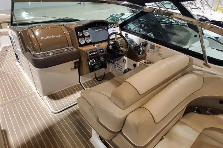 Slide: The Image of 2017 Formula 350 Crossover Bowrider interior with luxurious seating and modern dashboard. - 65