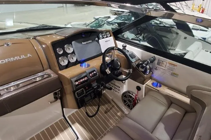 Slide: The Image of 2017 Formula 350 Crossover Bowrider cockpit with modern controls and luxurious seating. - 7