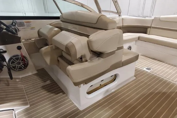 Slide: The Image of 2017 Formula 350 Crossover Bowrider interior with beige seating and wood-style flooring. - 72