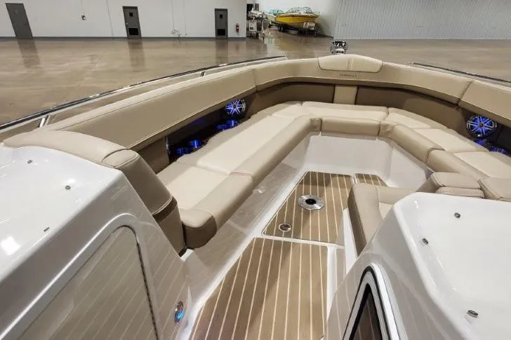 Slide: The Image of 2017 Formula 350 Crossover Bowrider interior with beige seating and wood flooring. - 8