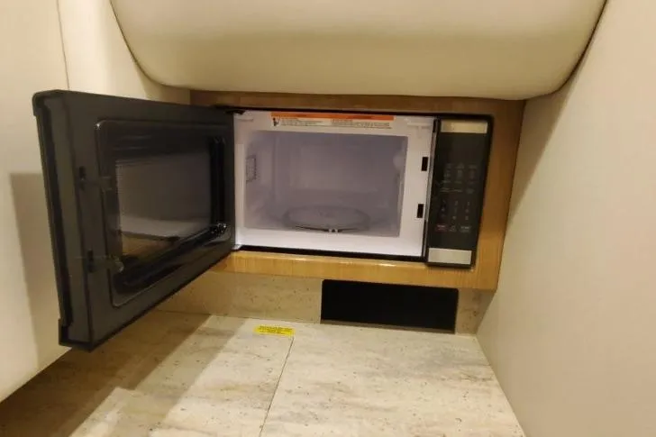 Slide: The Image of Microwave in 2017 Formula 350 Crossover Bowrider, open door, beige interior. - 9