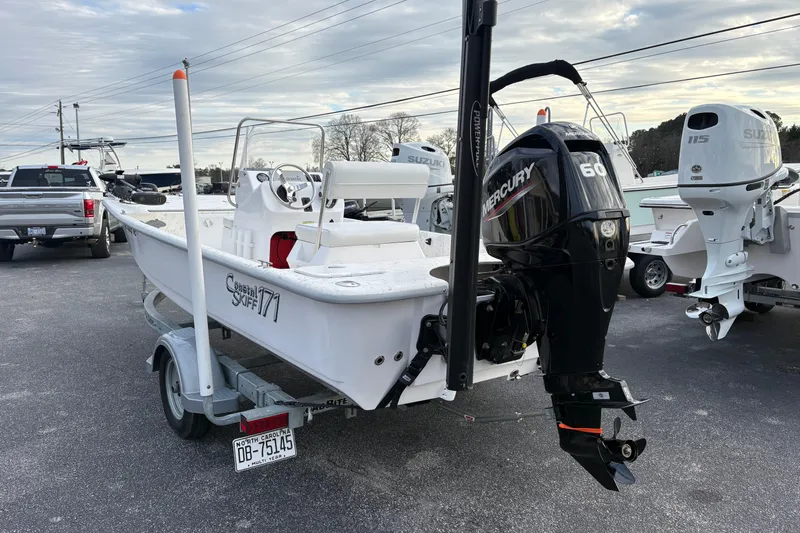 Slide: The Image of 2024 Coastal Skiff 171 boat with Mercury 60 engine on trailer. - 3