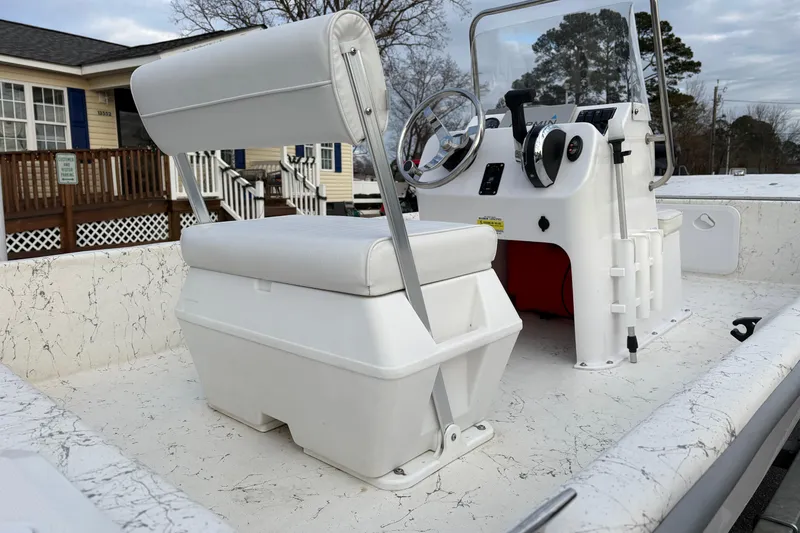 Slide: The Image of 2024 Coastal Skiff 171 boat interior with steering console and seating. - 6