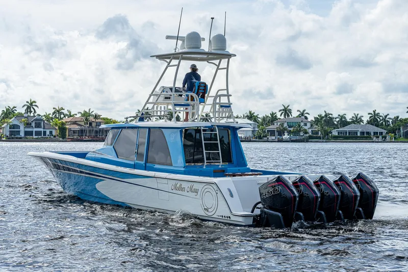 The Image of 2021 Gulf Crosser 52 boat cruising on water with multiple outboard engines. - 0