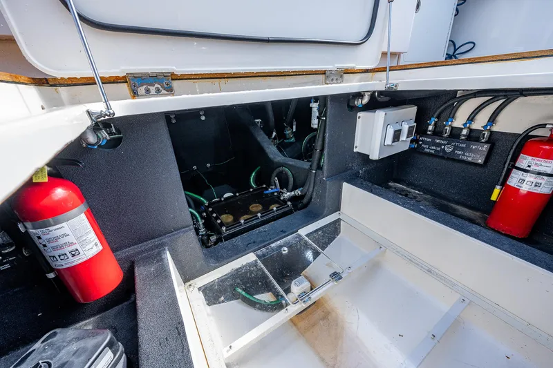 Slide: The Image of Engine compartment of a 2021 Gulf Crosser 52 boat with fire extinguishers. - 19