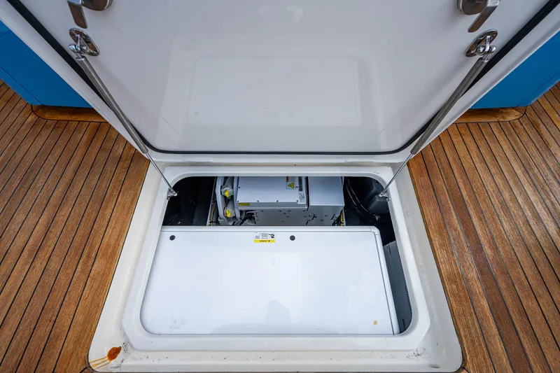 Slide: The Image of Open hatch on 2021 Gulf Crosser 52 yacht revealing engine compartment. - 24