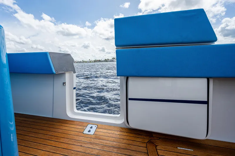 Slide: The Image of View from the deck of a 2021 Gulf Crosser 52 yacht with blue cushions. - 26