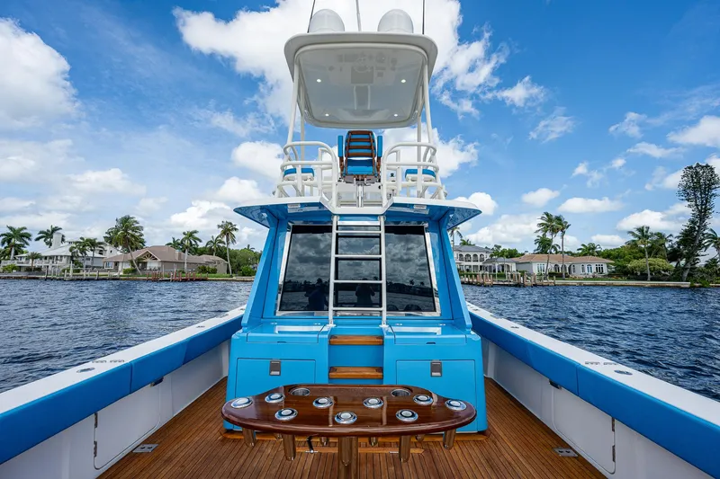 Slide: The Image of 2021 Gulf Crosser 52 yacht with blue accents on a sunny day. - 31