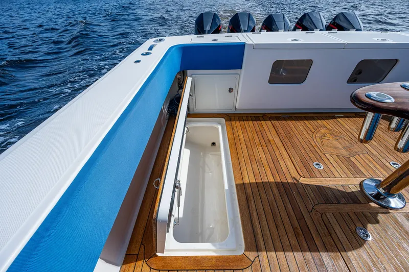 Slide: The Image of 2021 Gulf Crosser 52 boat deck with storage compartment and wooden flooring. - 37
