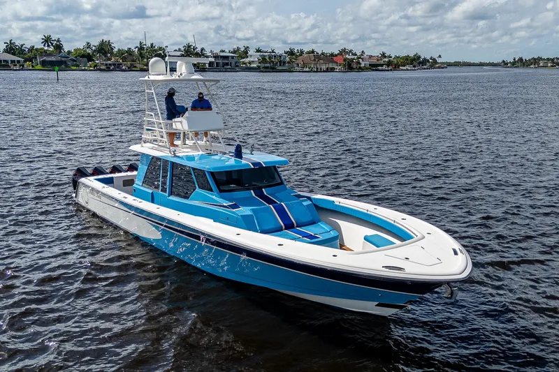 Slide: The Image of 2021 Gulf Crosser 52 yacht cruising on a calm waterway. - 40