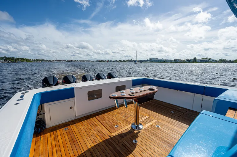 Slide: The Image of 2021 Gulf Crosser 52 boat deck with wooden flooring and ocean view. - 42