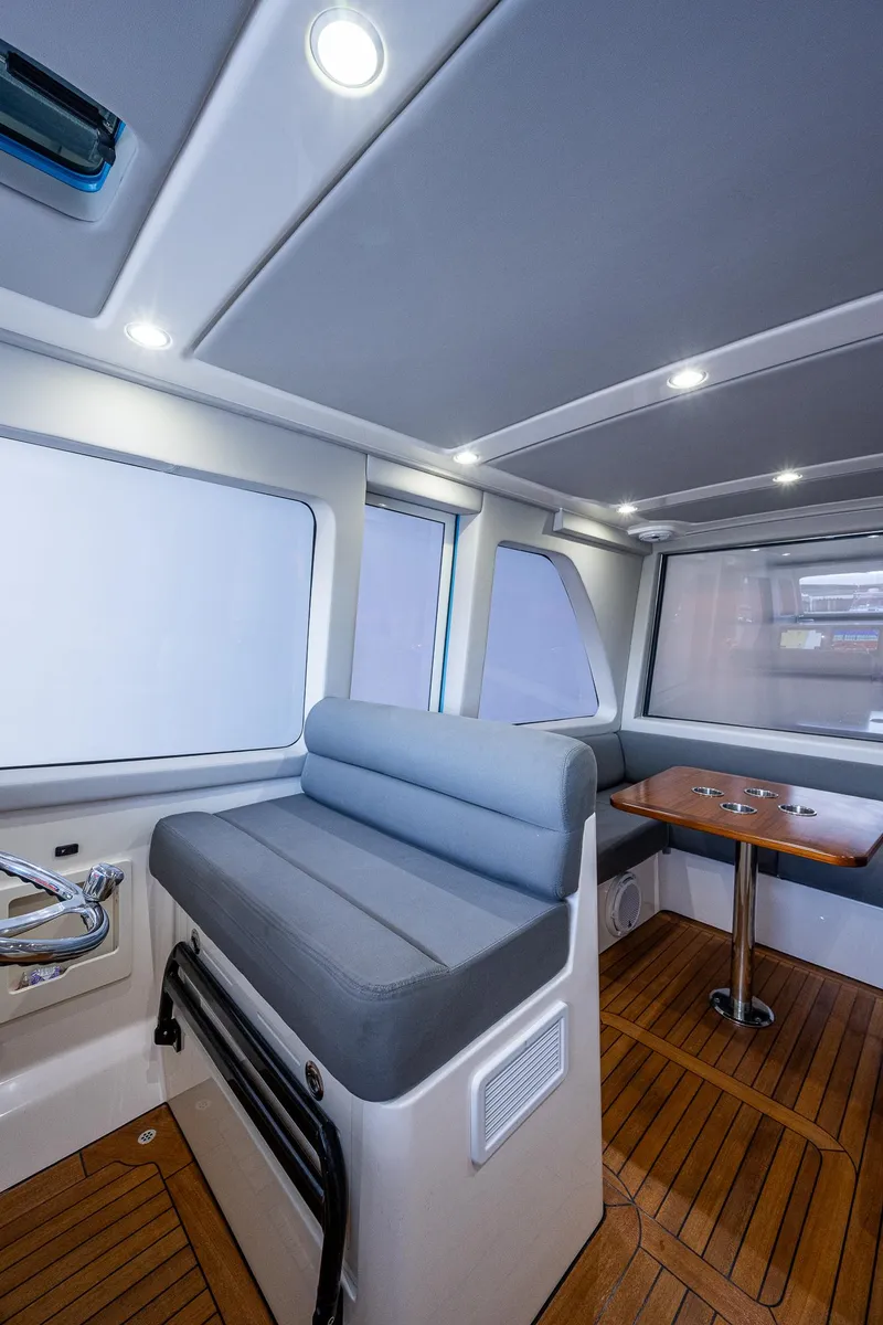Slide: The Image of Interior of 2021 Gulf Crosser 52 yacht with seating and wooden flooring. - 8