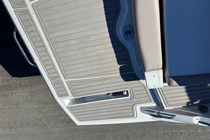 Slide: The Image of 2026 Crownline 278 SS boat deck with beige seating and sleek design. - 17