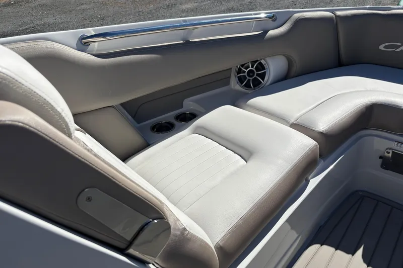 Slide: The Image of 2026 Crownline 278 SS boat interior with cushioned seating and built-in cup holders. - 6