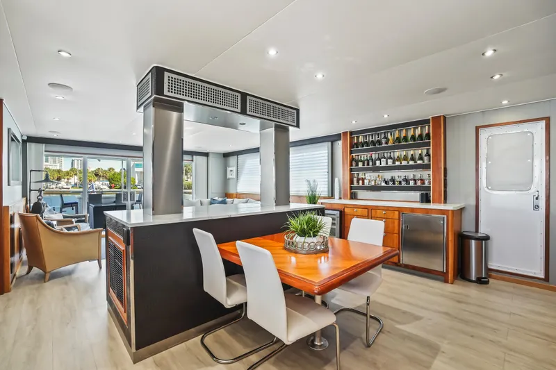 Slide: The Image of Luxurious 2009 Custom Flybridge Motoryacht interior with modern dining area and stylish decor. - 16