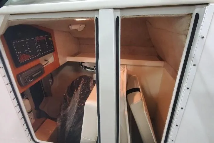 Slide: The Image of 2008 Formula 310 Bowrider cabin interior with control panel and seating. - 10