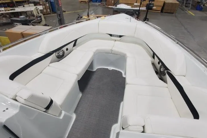 Slide: The Image of 2008 Formula 310 Bowrider boat interior with spacious white seating and modern design. - 11