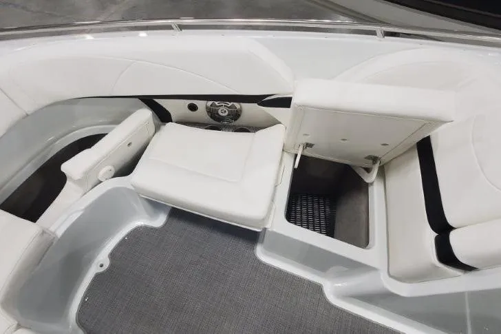 Slide: The Image of 2008 Formula 310 Bowrider interior with white seating and storage compartment. - 13