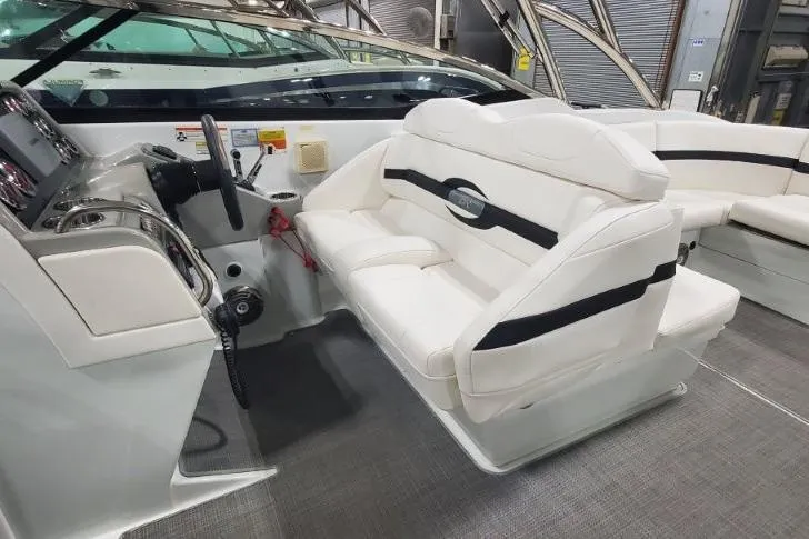 Slide: The Image of 2008 Formula 310 Bowrider interior with white seating and modern dashboard. - 18
