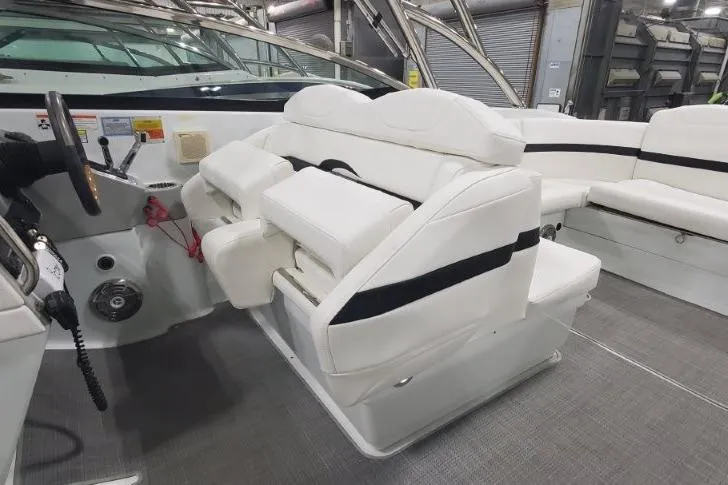 Slide: The Image of 2008 Formula 310 Bowrider interior with white seating and steering wheel. - 19