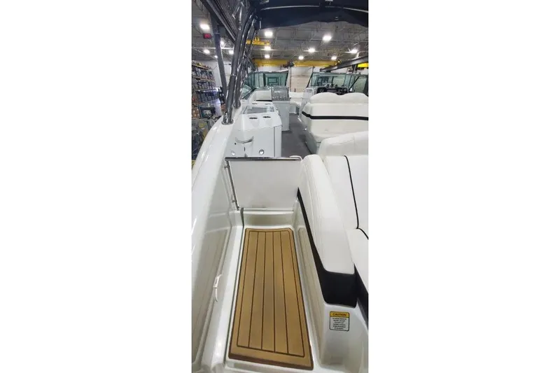 Slide: The Image of 2008 Formula 310 Bowrider interior with teak flooring and white seating. - 20