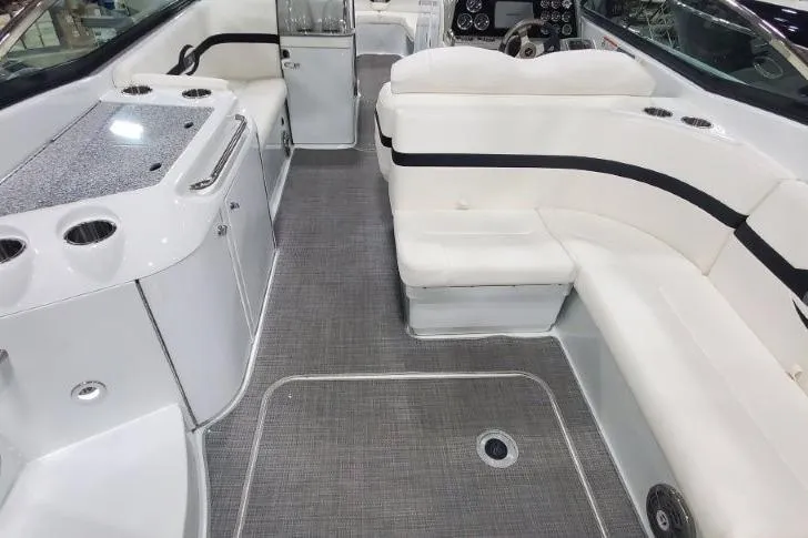 Slide: The Image of 2008 Formula 310 Bowrider interior with white seating and modern amenities. - 22