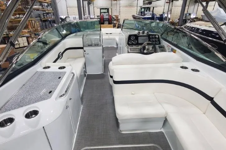 Slide: The Image of 2008 Formula 310 Bowrider interior with seating, steering console, and storage compartments. - 23