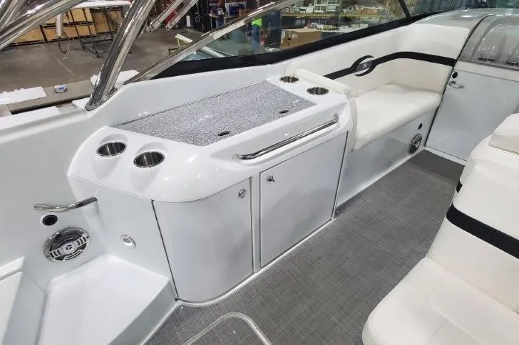 Slide: The Image of 2008 Formula 310 Bowrider interior with seating, cup holders, and storage compartments. - 26