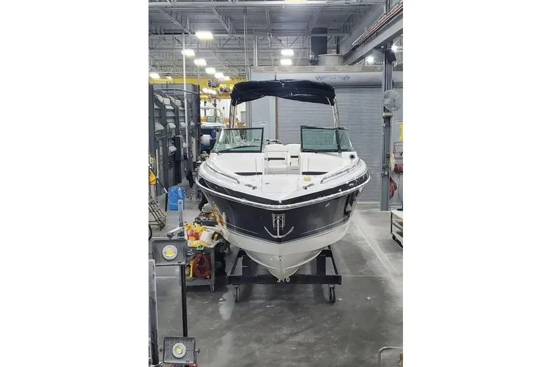 Slide: The Image of 2008 Formula 310 Bowrider boat in a workshop setting, front view. - 3