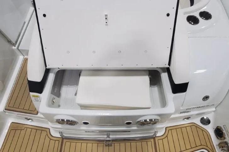 Slide: The Image of 2008 Formula 310 Bowrider boat with open storage compartment and teak flooring. - 30