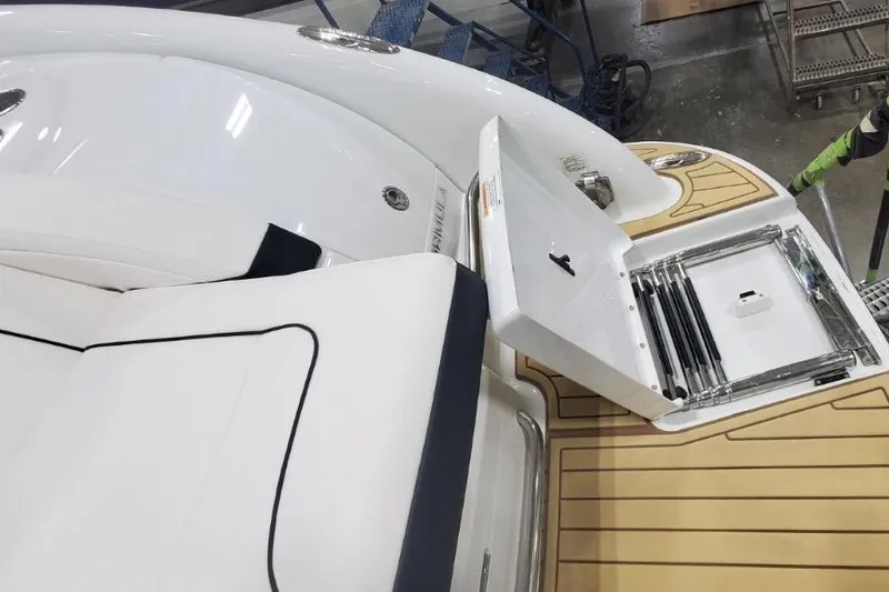 Slide: The Image of 2008 Formula 310 Bowrider boat interior with open storage compartment and cushioned seating. - 32