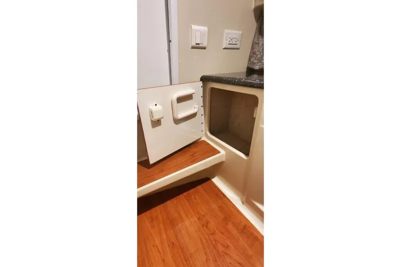 Slide: The Image of Open storage compartment in 2008 Formula 310 Bowrider boat interior. - 34