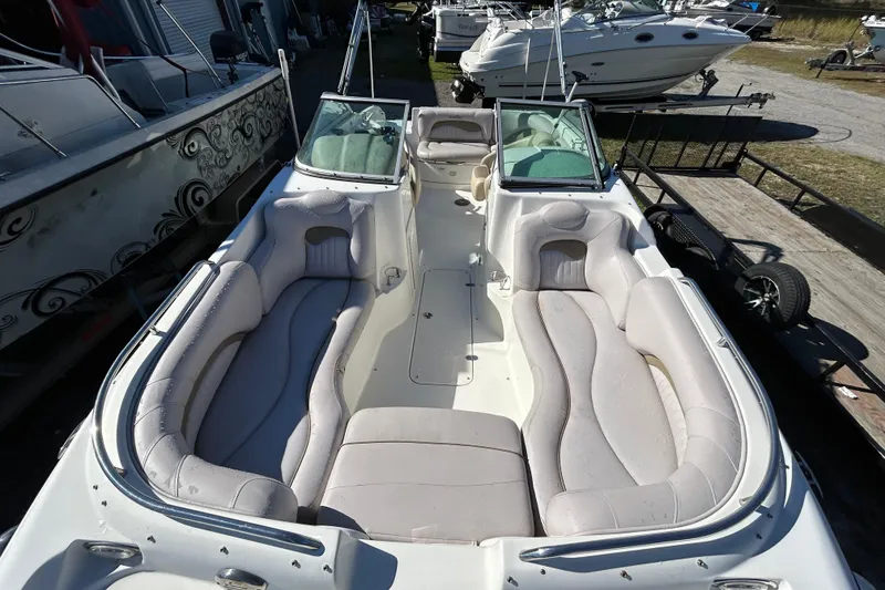 Slide: The Image of 2008 NauticStar 232DC Sport Deck boat with spacious seating and sleek design. - 1