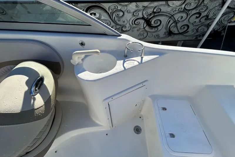 Slide: The Image of 2008 NauticStar 232DC Sport Deck interior with seating and storage compartments. - 11