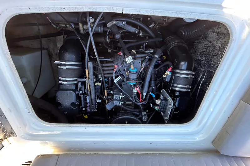 Slide: The Image of Engine compartment of a 2008 NauticStar 232DC Sport Deck boat. - 13