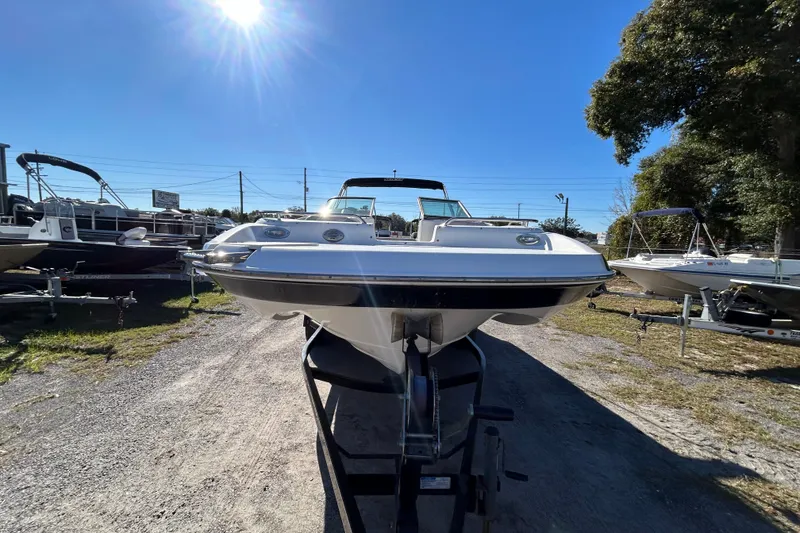 Slide: The Image of 2008 NauticStar 232DC Sport Deck boat on trailer under clear blue sky. - 20
