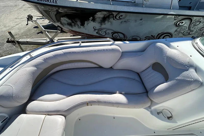 Slide: The Image of 2008 NauticStar 232DC Sport Deck boat with wet, cushioned seating area. - 3