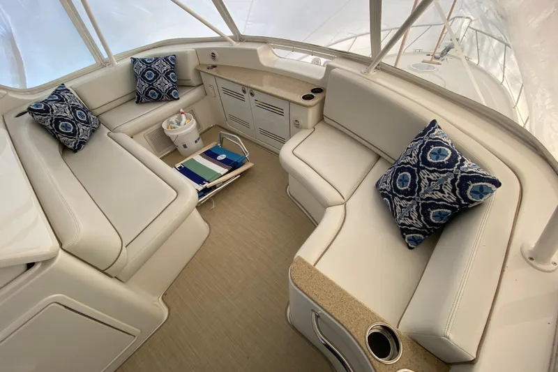 Slide: The Image of Luxurious interior of 2008 Silverton 45 Convertible yacht with plush seating and decorative pillows. - 13