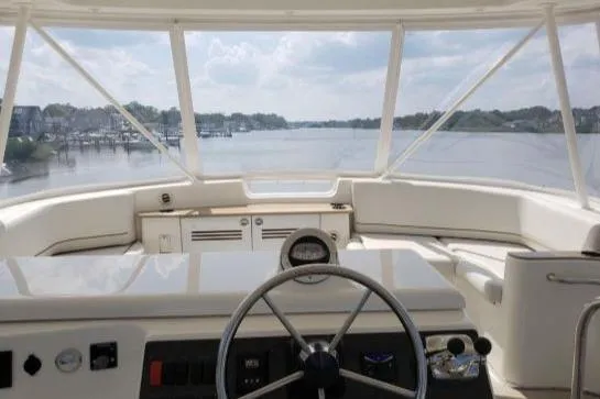 Slide: The Image of 2008 Silverton 45 Convertible yacht helm with scenic waterway view. - 14