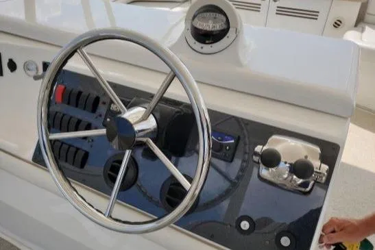 Slide: The Image of Helm of 2008 Silverton 45 Convertible yacht with steering wheel and controls. - 15