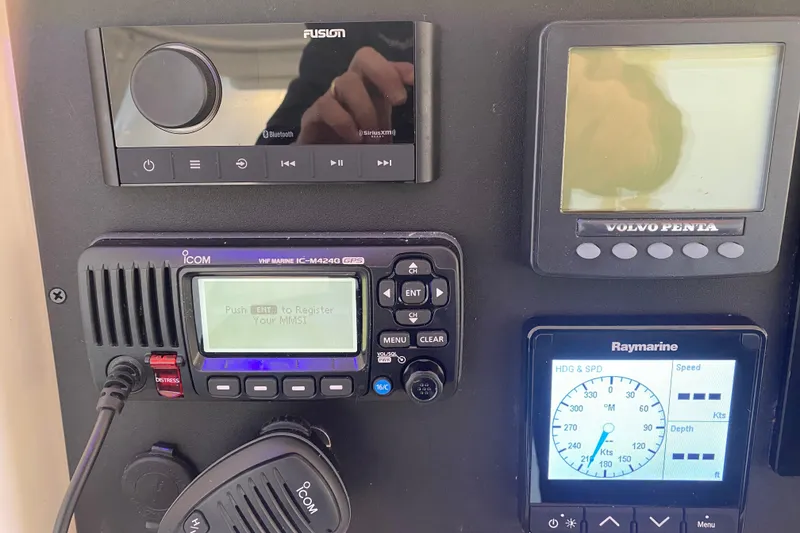 Slide: The Image of Control panel of a 2008 Silverton 45 Convertible boat with navigation and communication equipment. - 20