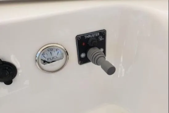 Slide: The Image of Control panel of a 2008 Silverton 45 Convertible boat with fuel gauge and thruster lever. - 22
