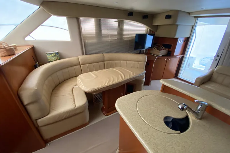 Slide: The Image of Luxurious interior of 2008 Silverton 45 Convertible yacht with plush seating and modern amenities. - 27
