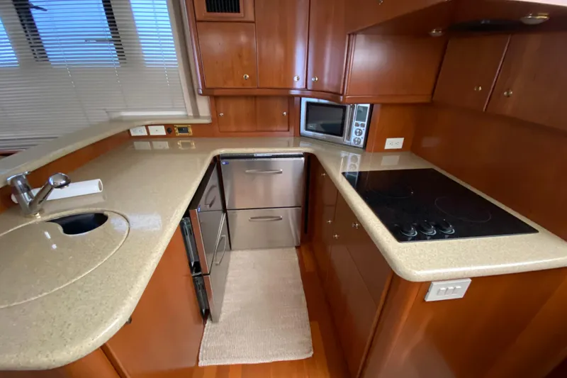 Slide: The Image of Luxurious kitchen in 2008 Silverton 45 Convertible yacht with modern appliances. - 30