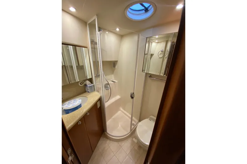 Slide: The Image of Luxurious bathroom in 2008 Silverton 45 Convertible yacht with shower and skylight. - 36