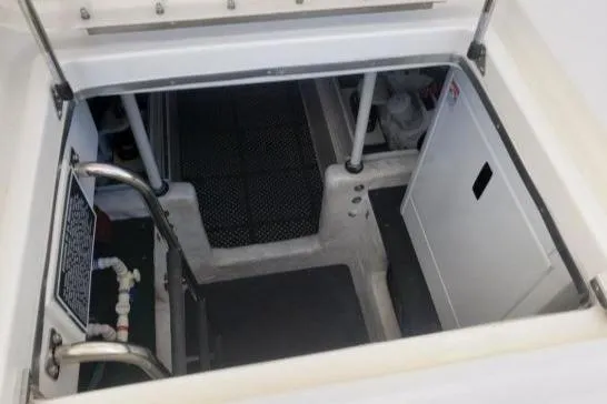 Slide: The Image of Engine room of 2008 Silverton 45 Convertible yacht, featuring access ladder and equipment. - 41