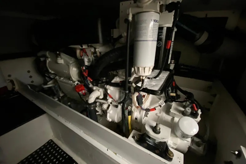 Slide: The Image of Engine room of 2008 Silverton 45 Convertible yacht, showcasing mechanical components. - 46